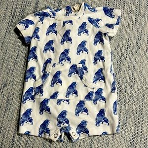 Kate Quinn shortie with buttons on the back with front pocket.